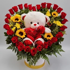 Caja de peluche y rosas en forma de corazón